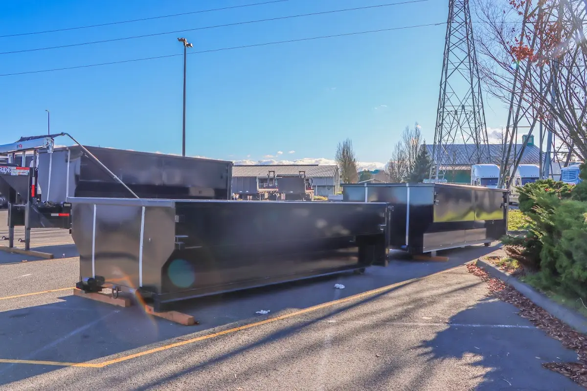 Roll-off dumpster ready for waste disposal at job site for Demolition Dumpster Rental in Lake Tapps